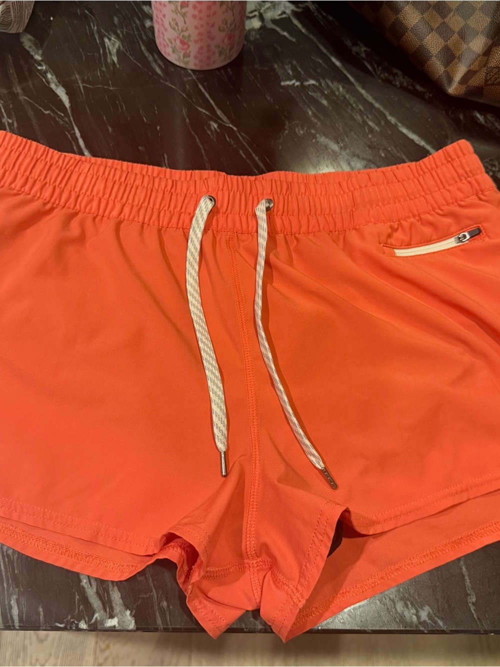 Vuori Women’s Bright Orange Athletic Shorts